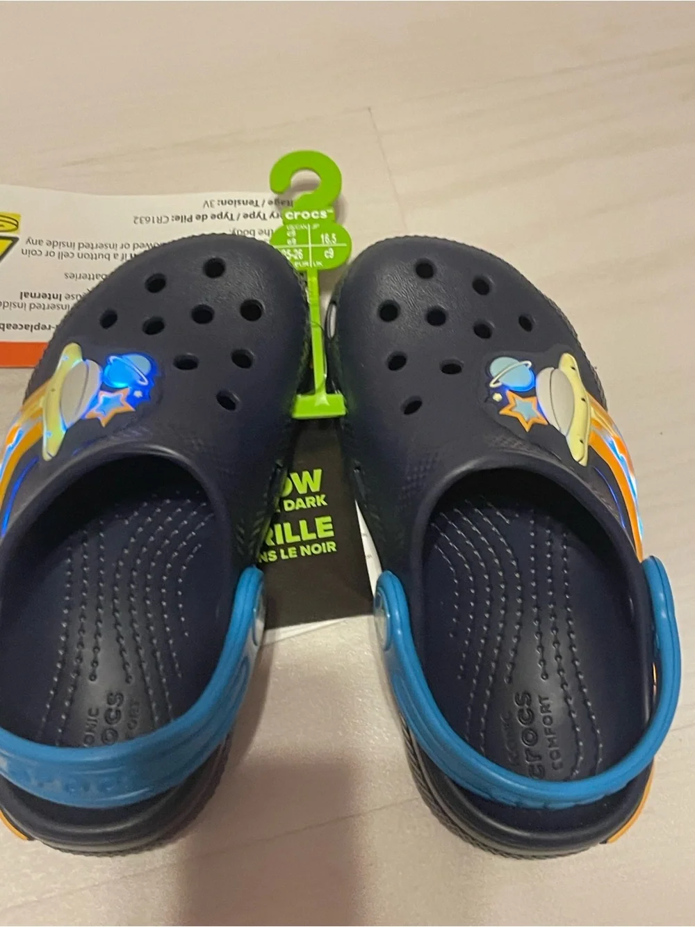 CROCS Kids Navy Light Up Clogs with Blue Straps and Orange-Yellow Space Accents